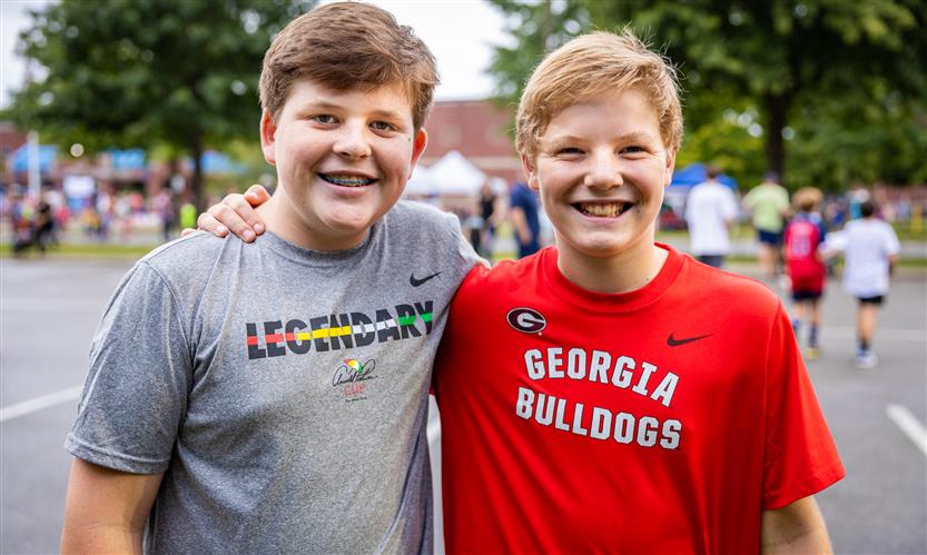 Two boys smile